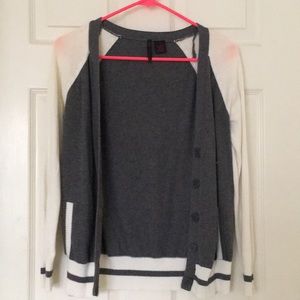 Gray and cream colored cardigan.